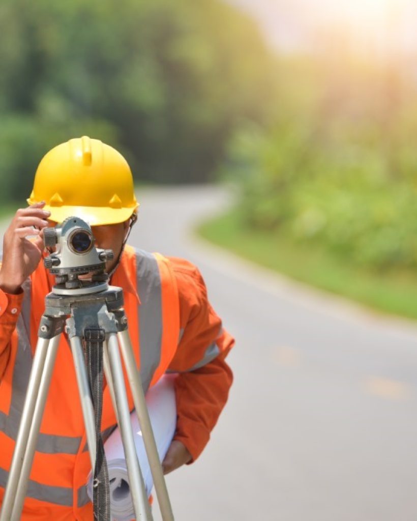 surveyor-engineer-worker-making-measuring-with-theodolite-road-works-survey-engineer-construction-site